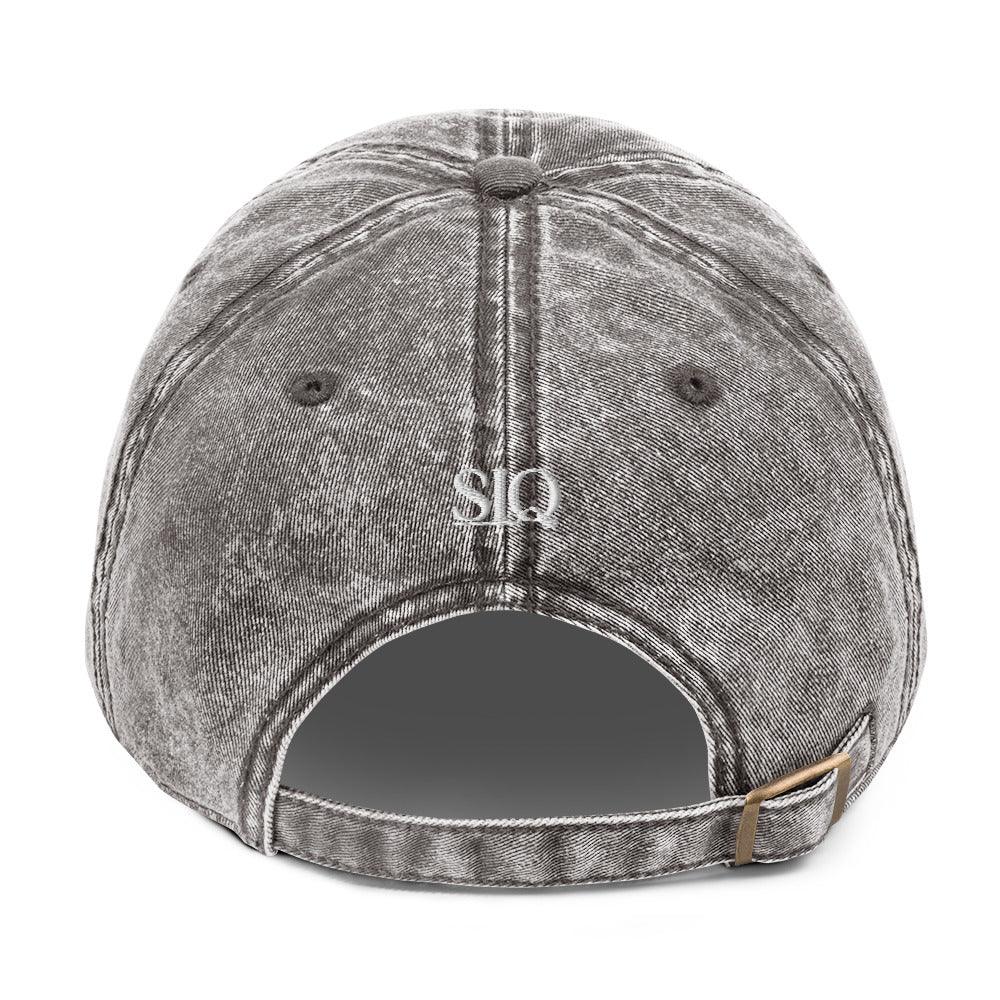 Back view of The Siq Collective good girl embroidered denim hat in faded black with adjustable strap