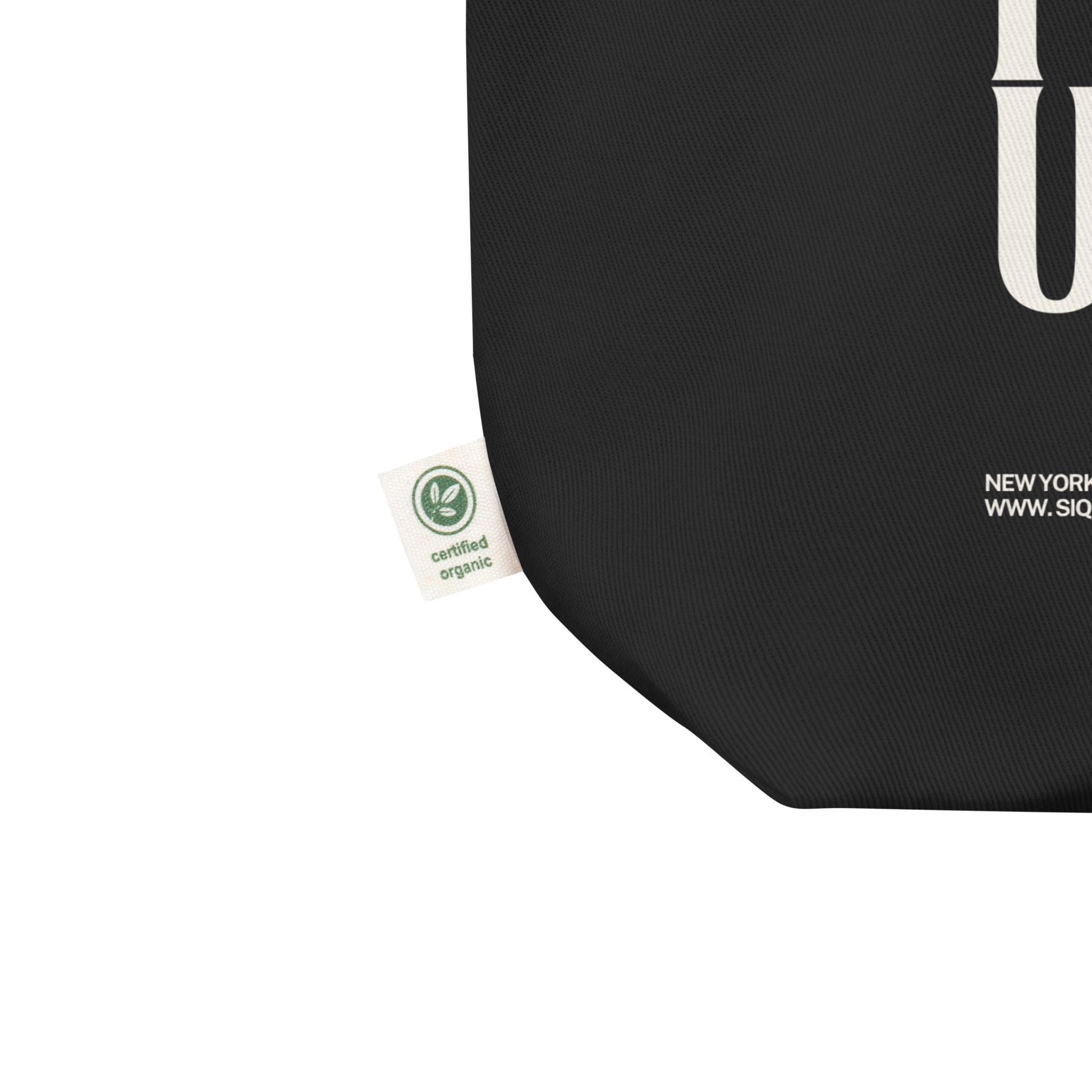 Close-up of certified organic label on black Should I Call UHaul Organic Tote by The Siq Collective