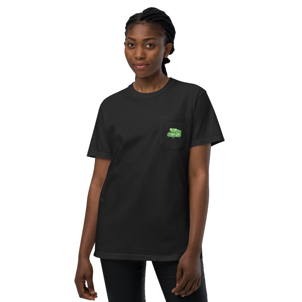 Woman wearing UHauler's Club Comfort Tee black pocket t-shirt with green graphic by The Siq Collective